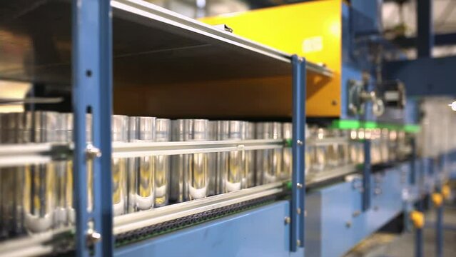 Conveyor line with the production of aluminum cans. Production of aluminum cans for drinks. Plant of high-tech equipment for the food industry.
