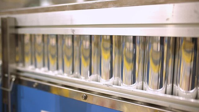 Conveyor line with the production of aluminum cans. Production of aluminum cans for drinks. Plant of high-tech equipment for the food industry.