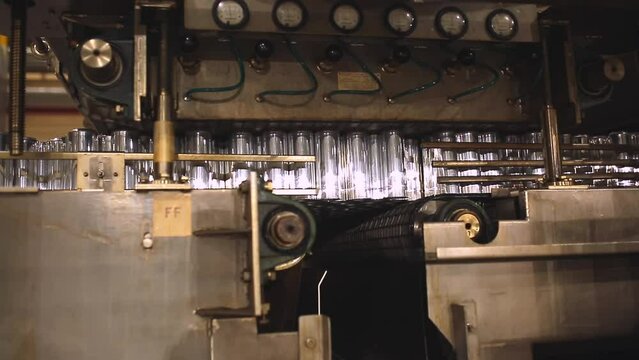 Conveyor line with the production of aluminum cans. Production of aluminum cans for drinks. Plant of high-tech equipment for the food industry.