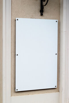 Emplty mounted outdoor glass signage for store, hotel or restaurant info mock up. Blank white glass signboard on wall mockup template.