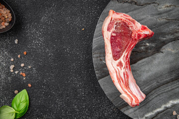 cutlet lamb meat raw on the bone slice meal food snack on the table copy space food background...