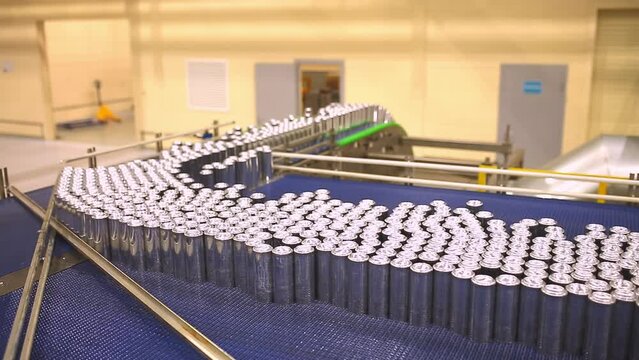 Conveyor line with the production of aluminum cans. Production of aluminum cans for drinks. Plant of high-tech equipment for the food industry.