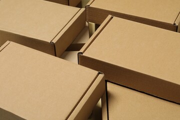 Many closed cardboard boxes as background, closeup - obrazy, fototapety, plakaty