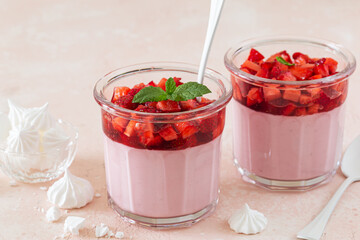 strawberry mousse dessert in glass with meringues
