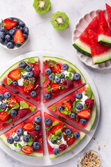 watermelon pizza with yogurt and fresh berries,