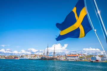 Swedish flag on the boat in Gothenburg islands archipelago near Donso island