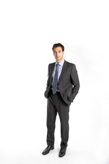 Obraz premium Handsome businessman in black suit stands isolated on white background