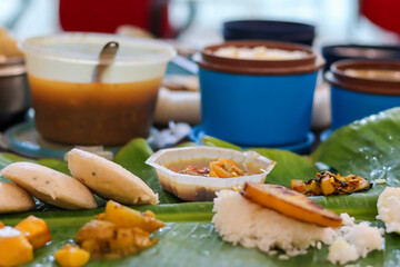 Office Lunch in Tiffin Boxes with Green Banana Leaf