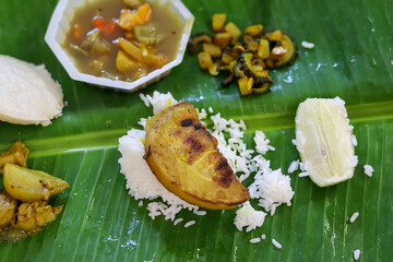 Office Lunch in Tiffin Boxes with Green Banana Leaf