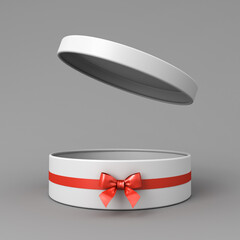 Blank open white round gift box or cylinder present box with red ribbon and bow isolated on dark grey background with shadow minimal conceptual 3D rendering