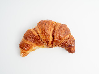 Croissant on a white background. Baked goods croissant close-up.