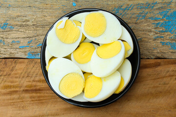 Boiled chicken eggs in a plate top view 