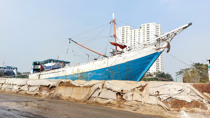 Sunda Kelapa old Harbour with fishing boats, ship and docks in Jakarta, Indonesia