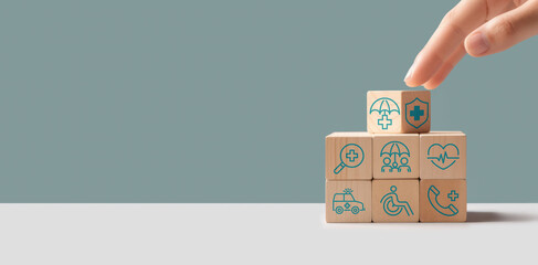 Health insurance concept, Health care checkup, Access to welfare health, Wellness and medical, Wood cube and healthcare insurance icon on pastel background, World health day, Save on treatment costs