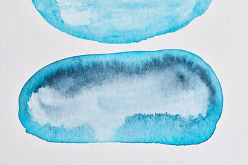 Abstract blue background. Watercolor ink multicolor art collage. Stains, blots and brush strokes of acrylic paint on white paper.