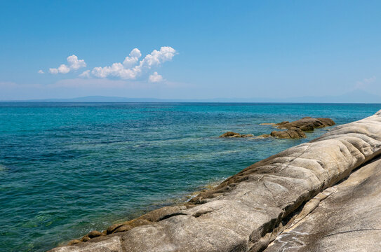 bright and vivid summer image of the rocks in the Greek sea