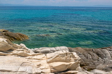 bright and vivid summer image of the rocks in the Greek sea