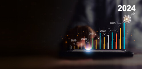 2024 Businessman analyzing company financial balance sheet working with digital virtual graphics Businessman calculating financial data for long term investment growth goals