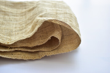 brown sackcloth texture background, folded burlap fabric textile for design