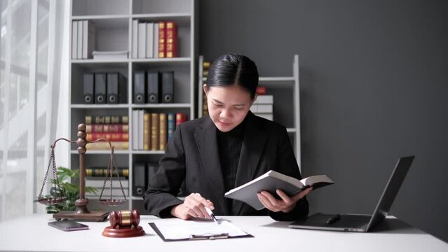 lawyer working with contract papers and wooden gavel on tabel in courtroom. justice and law ,attorney, court judge, concept.