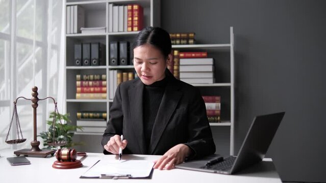 lawyer working with contract papers and wooden gavel on tabel in courtroom. justice and law ,attorney, court judge, concept.