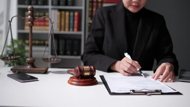 lawyer working with contract papers and wooden gavel on tabel in courtroom. justice and law ,attorney, court judge, concept.