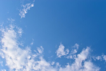 beautiful blue sky and white fluffy group of clouds with sunrise in the morning, natural background