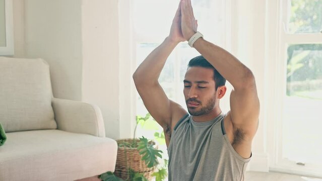 Hands, namaste and meditation with man and yoga at home, fitness and mindfulness with zen, calm and spiritual. Prayer, peace and exercise in living room, health and wellness for healing and self care