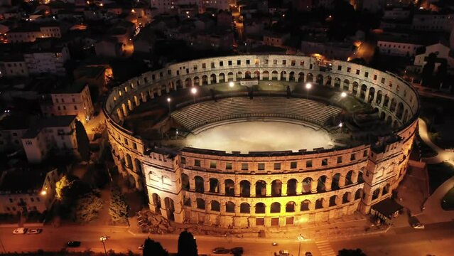 Amphitheatre in Pula, Croatia, night aerial view. Historic centre of Pula. Ruins of roman amphitheatre. 