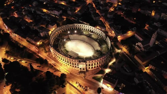 Amphitheatre in Pula, Croatia, night aerial view. Historic centre of Pula. Ruins of roman amphitheatre. 