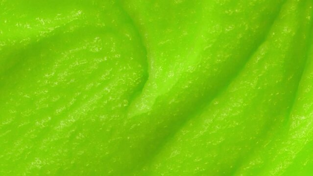 Smoothie with fresh green vegetables and fruits. Berry and yogurt ice cream. The texture of the sorbet. Delicious sweet dessert close-up as a background.