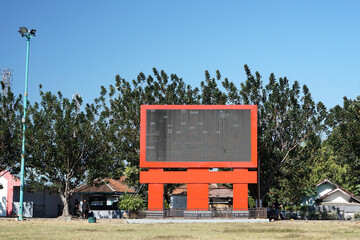A blank videotron or Large LED display in a park, can be used as a mock up.                     