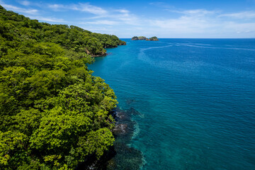 Beautiful aerial view of Playas del Coco, Hermosa Beach and its green mountains, bay and yachts in Costa Rica