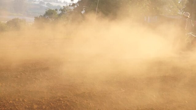 Dust when farmers plow land in Don Duong Lam DongDust when farmers plow land in Don Duong Lam Dong