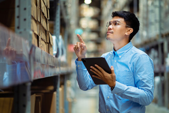 Warehouse staff check stock, inventory, stock control and warehouse management. logistics concept factory business export industry.