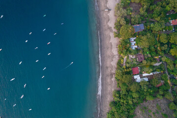Beautiful aerial view of Playas del Coco, Hermosa Beach and its green mountains, bay and yachts in Costa Rica