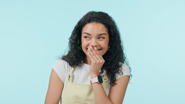 Young, happy woman and laughing in studio for funny information, news and joke or gossip. Face of a teenager or shy african student smile for secret, comedy or meme and cover mouth on blue background