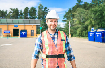 worker on recycle center working on a sunny day