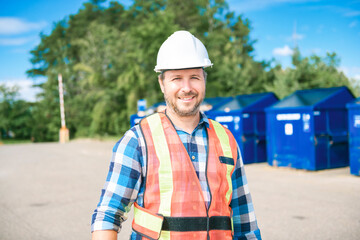 worker on recycle center working on a sunny day