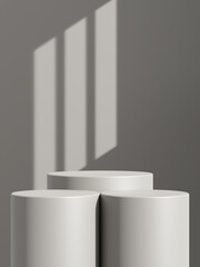 Empty gray podium or pedestal display on gray shadow background with cylinder stand concept