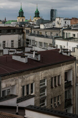 Obraz premium Contrast of roofs and old tenements of Warsaw.