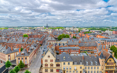 Fototapeta na wymiar Aerial panoramic view of Amiens historical city centre with roofs of old buildings, panorama of Amiens cityscape amazing view, Somme department, Hauts-de-France Region, Northern France