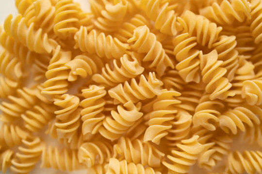 Texture of durum wheat semolina pasta called Fusilloni typical of the Amalfi coast. Gragnano pasta, bronze die, Naples Italy