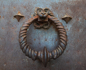 Spectacular medieval metal door knocker of ancient building