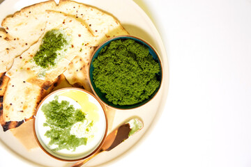 Vegan recipes with tortillas and wolffia spread on wooden plate. Wolffia is the nutrient-rich plant-based source of protein and omega3 and vital minerals.