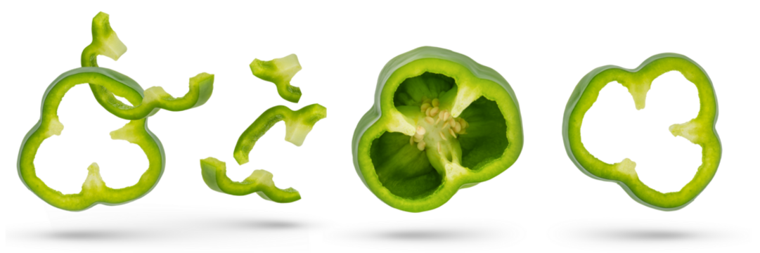 Set of green paprika cloves on a white isolated background close-up. Paprika of different sizes fall, casting a shadow, for insertion into a design or project