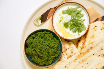 Vegan recipes with tortillas and wolffia spread on wooden plate. Wolffia is the nutrient-rich plant-based source of protein and omega3 and vital minerals.