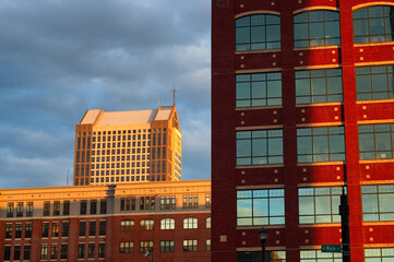 Downtown buildings in Columbus, Ohio, form a montage of architectural styles in early evening sunlight.