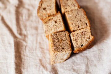 Fresh banana cake on natural fabric side view. Atmospheric concept of delicious pastries
