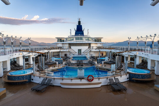 Celebrity Millennium cruise ship. Celebrity Cruise Line. Pool deck, hot tubs, lounge chairs, funnel or smokestack. 
